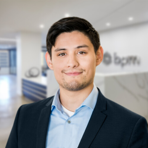 man-in-suit-standing-in-office