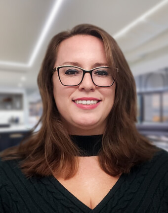 woman-wearing-glasses-standing-in-office