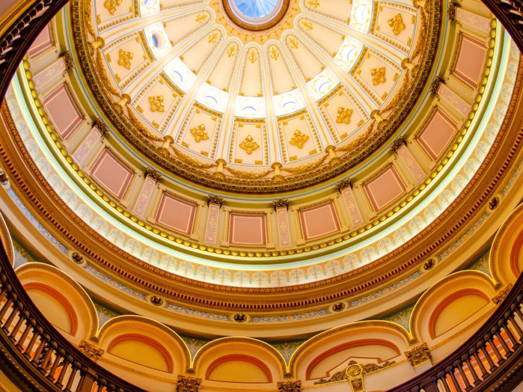 Looking up towards circular ceiling of a capital building
