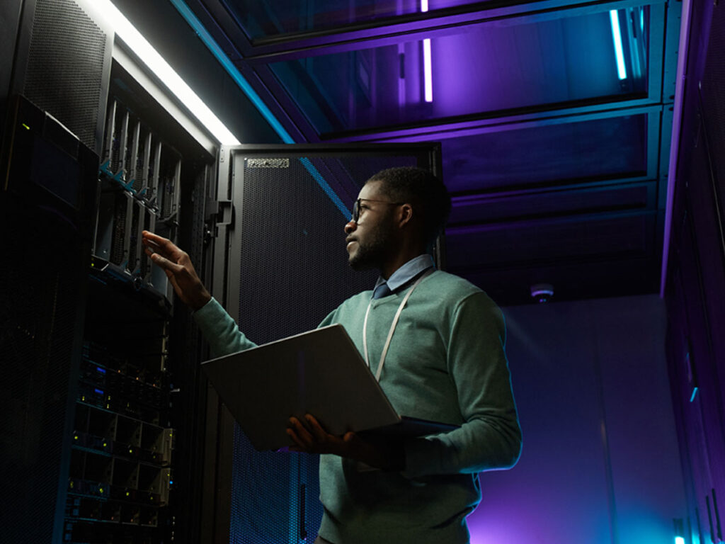 IT security professional working at a server