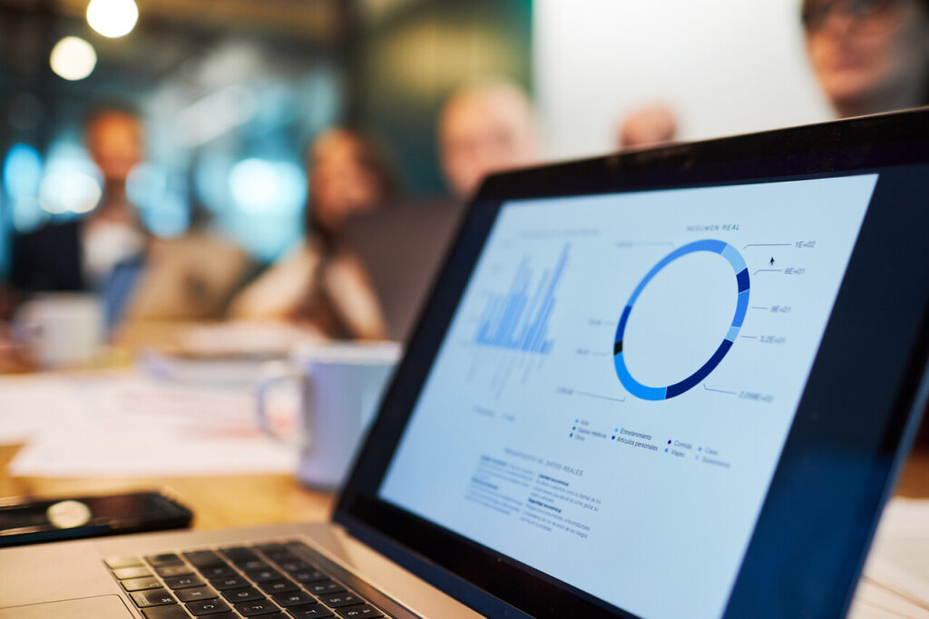 Close up view of a laptop with a business chart on the screen.