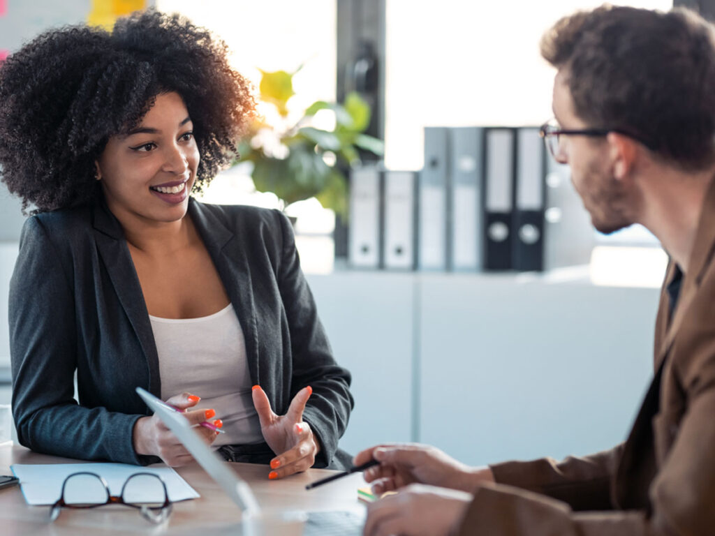 manager talking to employee in an office