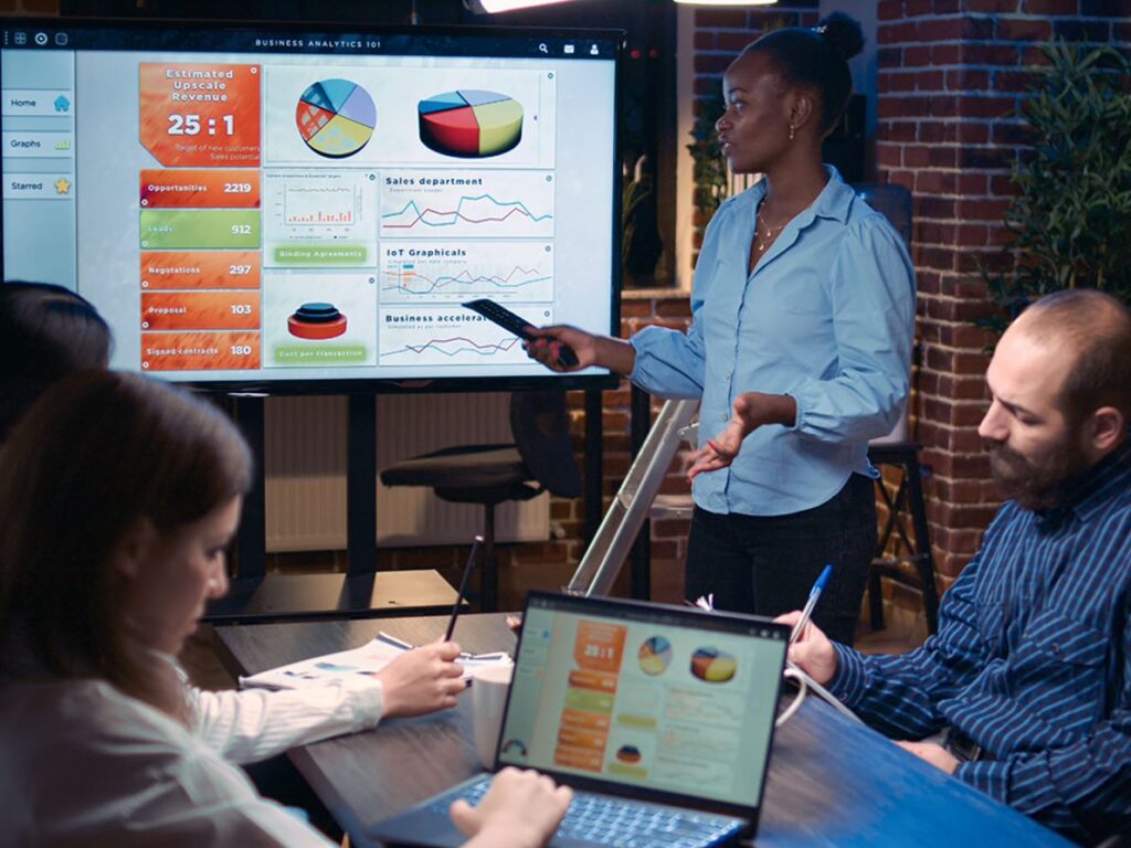 woman sharing an ERP display to a group of people