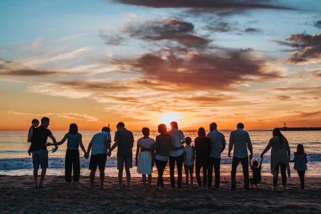 group of people outside during a sunset