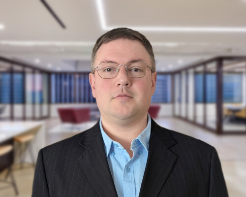 Senior Penetration Tester standing in San Francisco office.